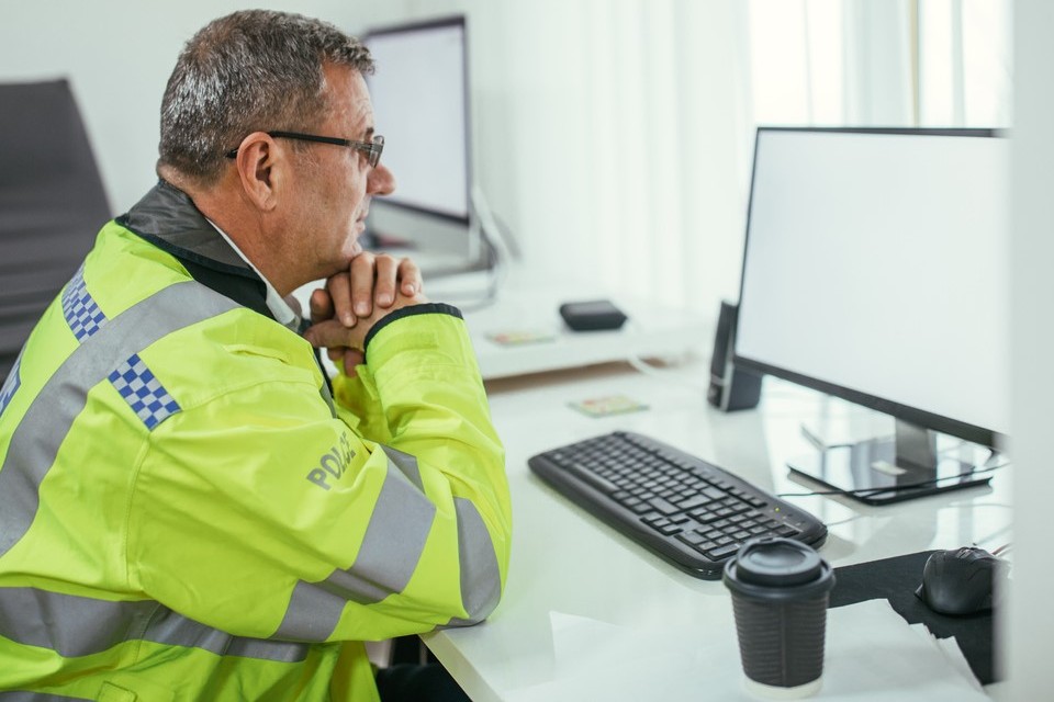 Police Officer at desk