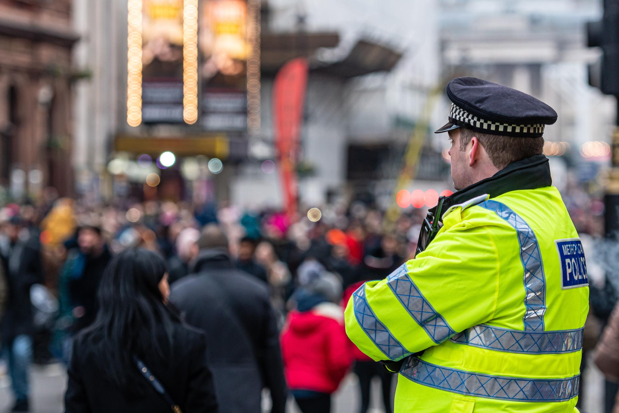 Police officer in crowded place