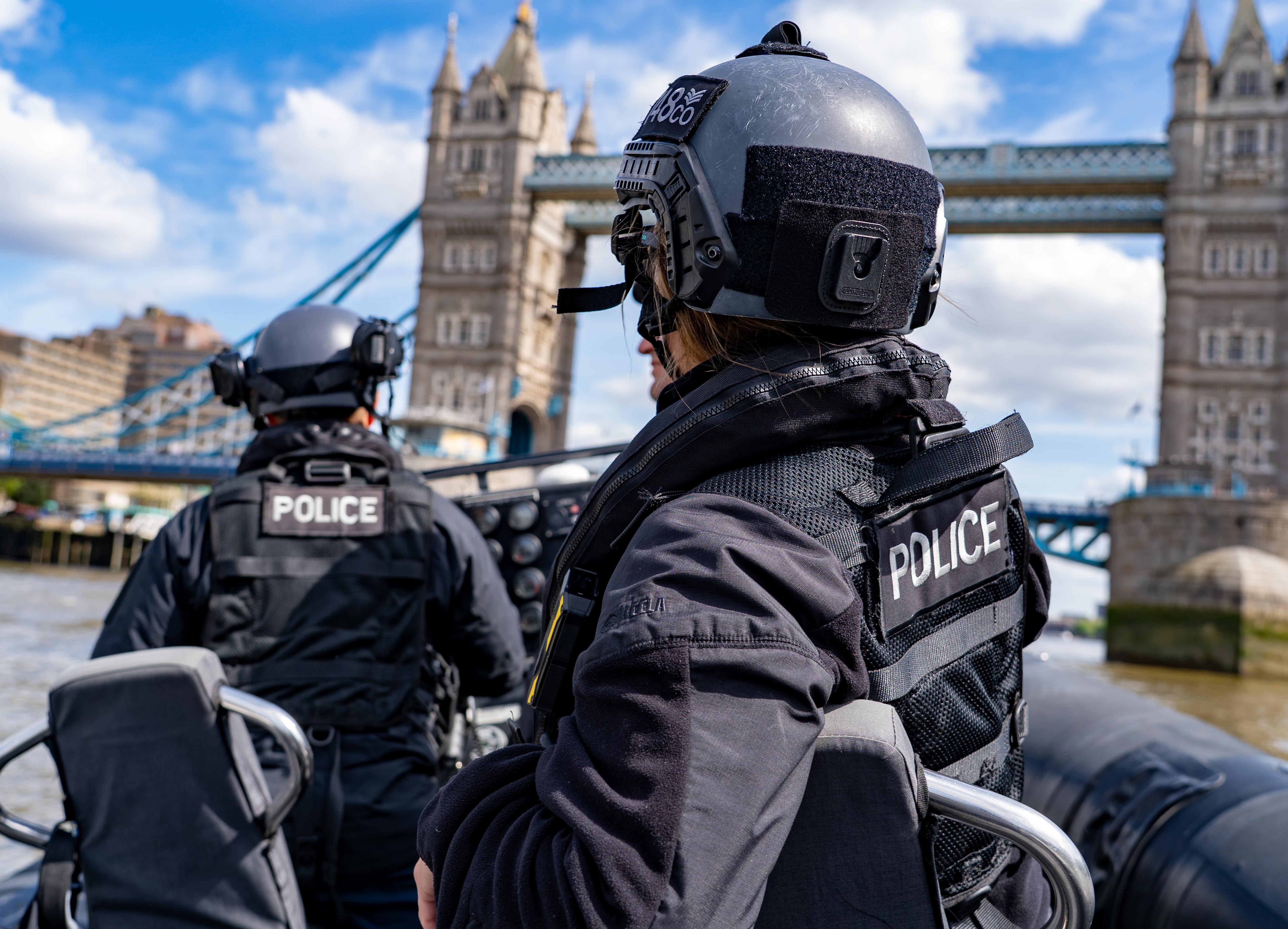 An image of two police officers on a boat