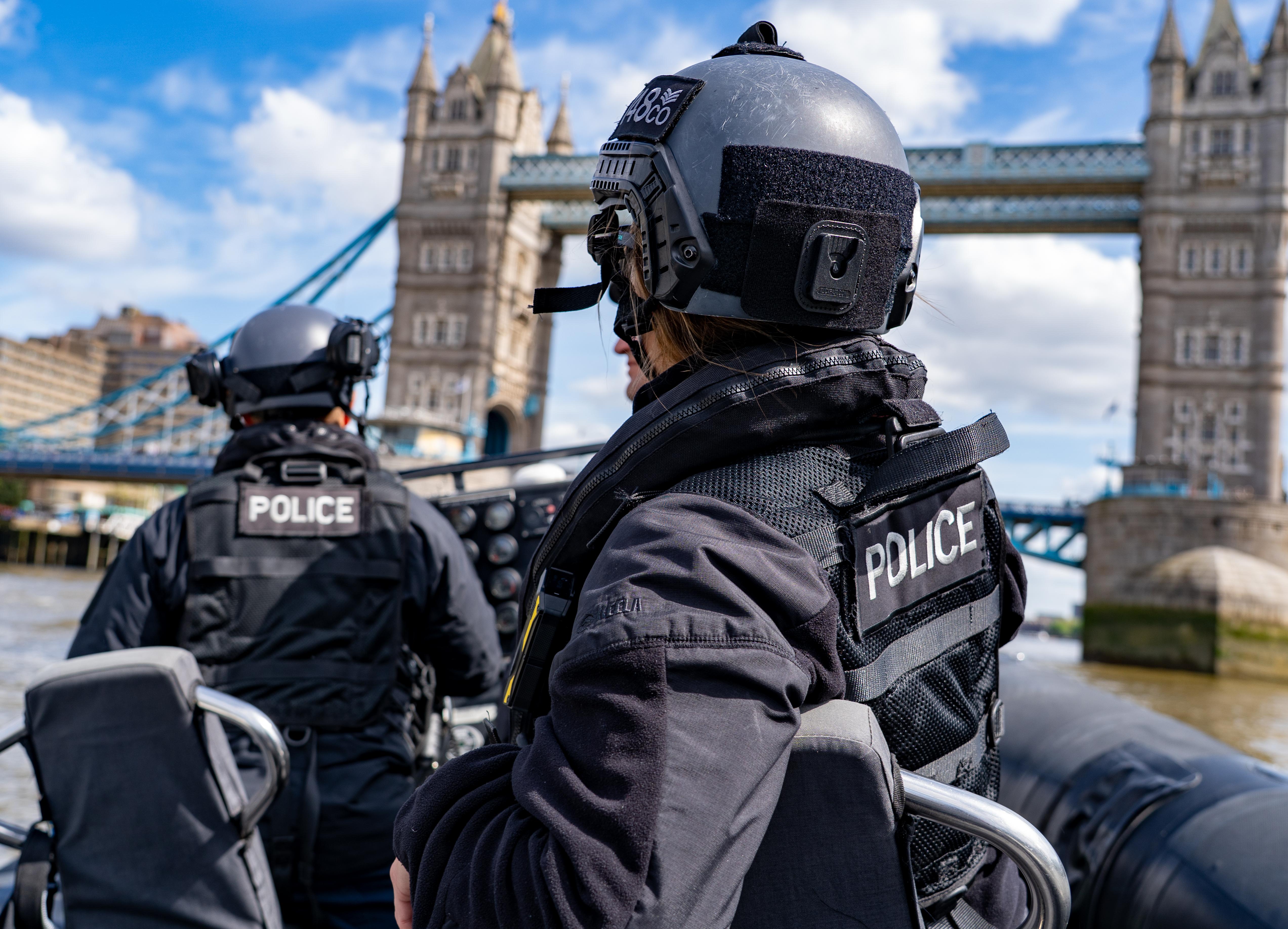 An image of two police officers on a boat